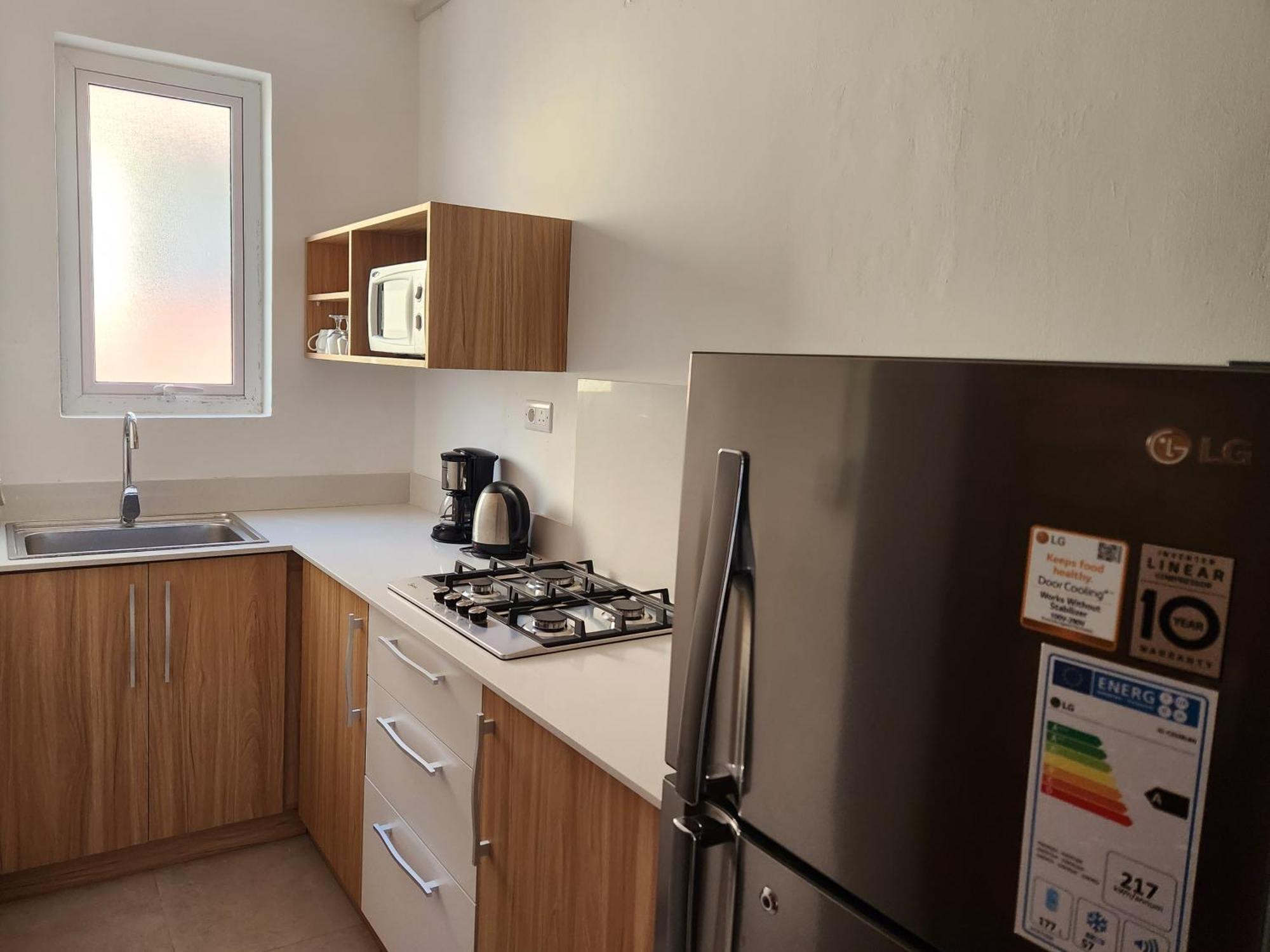 La Perla Holiday Apartments Pereybere Beach Room photo